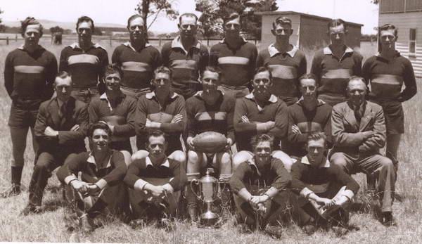 Inverleigh 1950 premiers (John extreme left front row).  Captain Rob Wishart with ball.  Ivan Witcombe (third from left in back row)